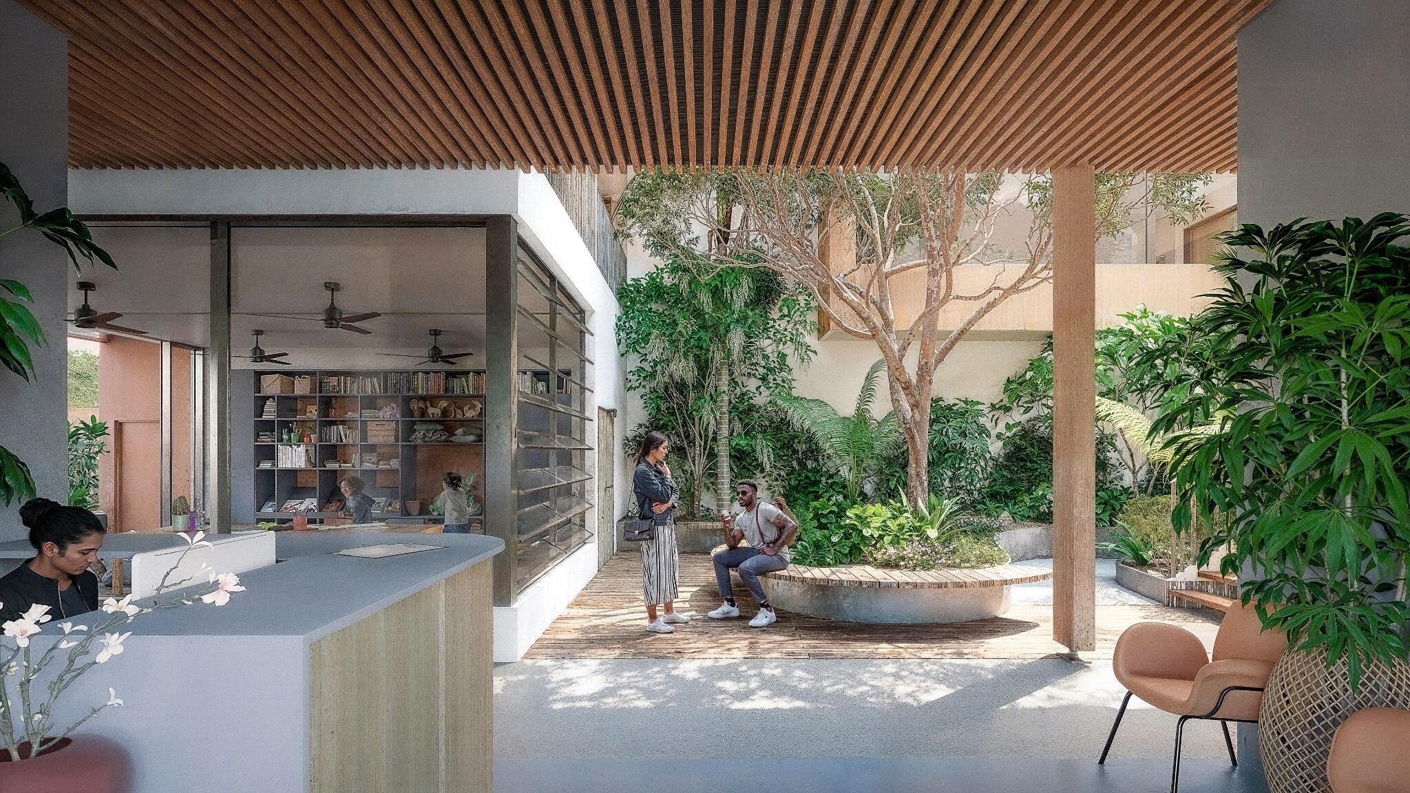 Accueil du CMPEA Saint-Louis ouvert sur un patio planté, avec une banquette circulaire autour d’un arbre.